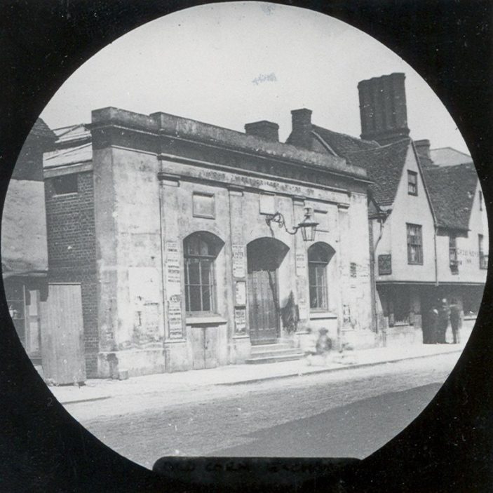 This is the old Corn Exchange, built in the early 1840s on the site previously occupied by the gaol or 'lock-up'. Prior to this trading in corn was done at the back of the Shire Hall. Part of the Cross Keys Inn can be seen on the right. | Hertfordshire Archives and Local Studies/Mr Elsden